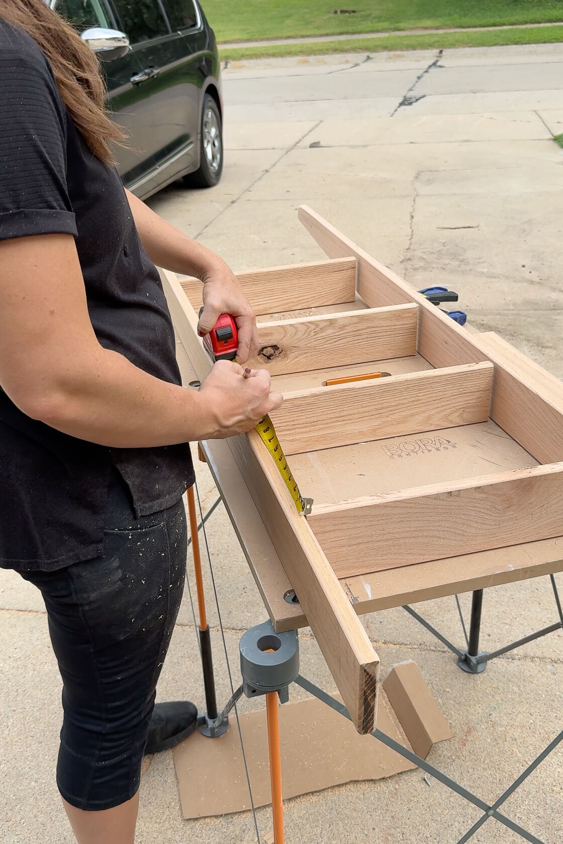 Putting runs in on a DIY ladder for kids' bunk beds.